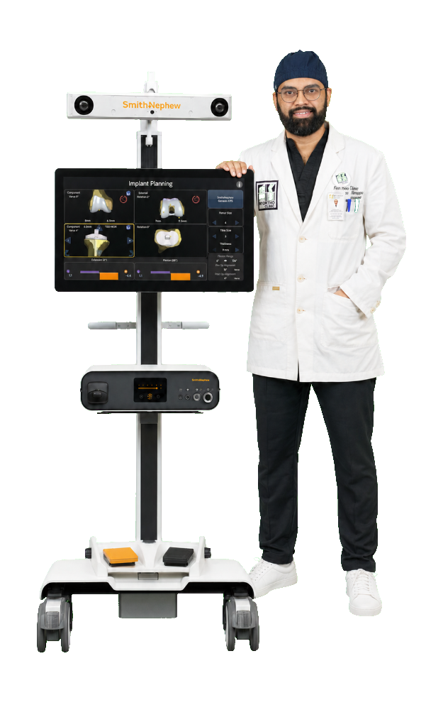 Dr. Vikram Byre next to Smith & Nephew Robotic Joint System
